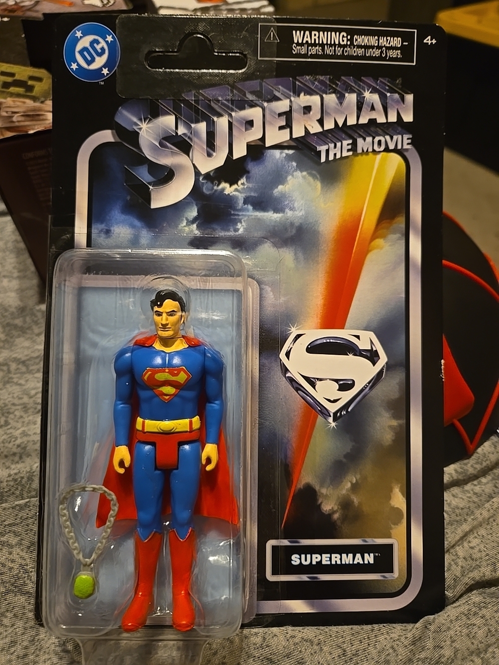 DC Superman Movie Back-Card Showcase — Blue, Red, Black, White, Tan